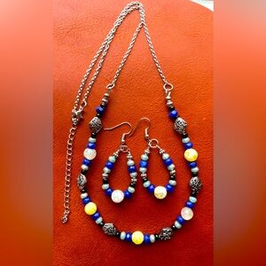Matching handmade necklace and earring set.